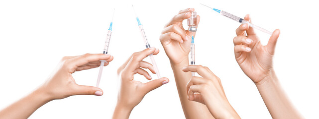 Hand holding syringe with vaccine against corona virus.