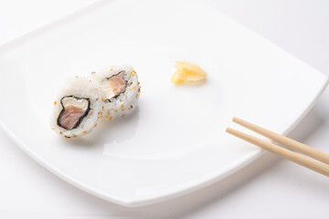urakami style sushi roll on white plate and white background