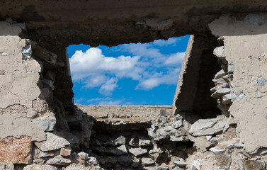 Destroyed roof of old fortification building. Blue sky. Old stone building. Ust-Kamenogorsk (Kazakhstan). 2020.