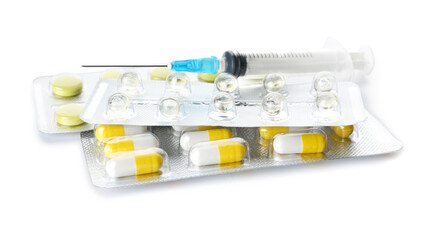 Pills and syringe for injection on white background