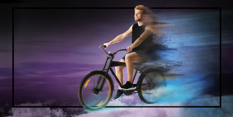 Obraz na płótnie Canvas Sporty young man riding bicycle on dark color background