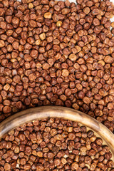 Raw Gray peas and round wooden bowl. Organic healthy diet food. Legumes bean seed. Traditional Latvian product.