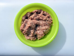
a plate of fresh minced meat is on the table