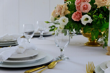 Table setting with beautiful flowers in restaurant.