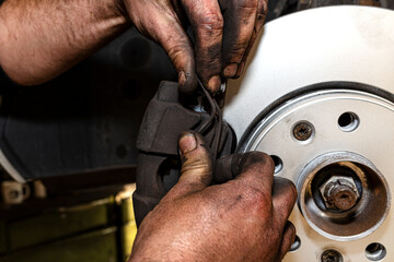 New brake disc with an anti-corrosion layer, mounted on the front hub, installing the brake pads,...