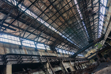 An abandoned old large industrial hall is waiting to be demolished. Former Khabarovsk plant for the production of diesel engines.