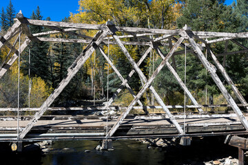 Rickety old wooden bridge over the Pecos River in New Mexico
