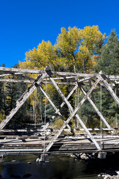 Rickety old wooden bridge over the Pecos River in New Mexico