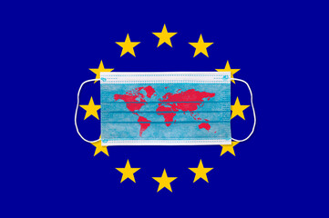 Protective face mask on Europe union flag. Covid-19 outbreak around the world. The global economic crisis. Crash by coronavirus. Life in lockdown around the world