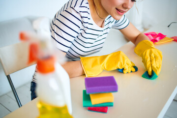 Woman cleans sponge table household cleaning service lifestyle