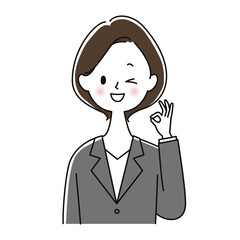 OKサインを出しウインクするスーツ姿の女性