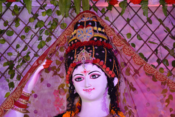 Closeup of face of Goddess Durga, Idol of goddess Durga, hindu festival navratri.