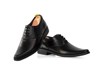 Men fashion black leather oxford shoes with shoe tree (shape supporter) isolate on white background.