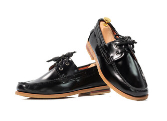 Men fashion black leather boat shoes with shoe tree (shape supporter)  isolated on white background. Clipping path