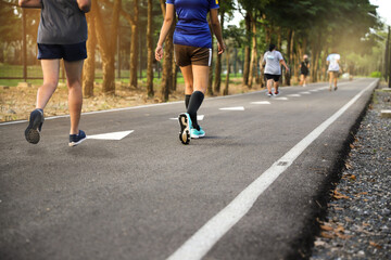 Group of people exercise walking in the park in morning