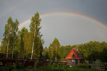 rainbow over the wood - after a rain