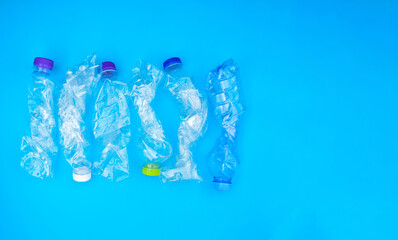 Isolated twisted plastic bottles, concept for making smaller size befor recycling and reducing the garbage process to reduce global warming and to reduce pollution around the world.