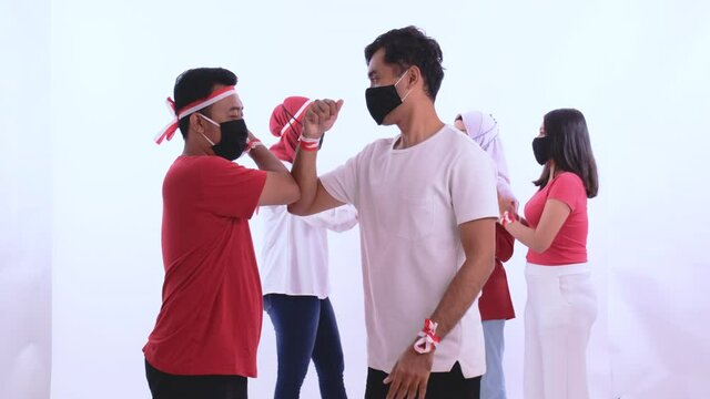 indonesian people elbow shake hand during independence day due to corona virus outbreak