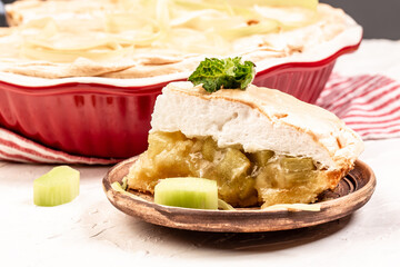 Traditional Swedish cuisine. homemade rhubarb cake with meringue on top, light background, Food recipe background. Close up