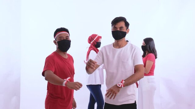 indonesian people elbow shake hand during independence day due to corona virus outbreak