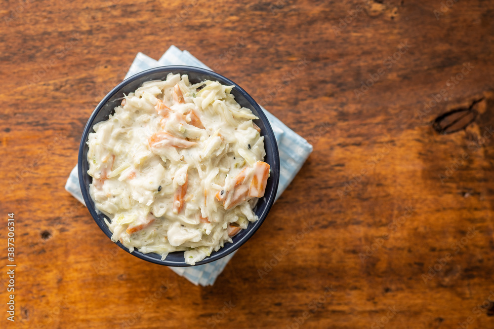 Poster Coleslaw. Salad made of shredded white cabbage and grated carrot with mayonnaise.