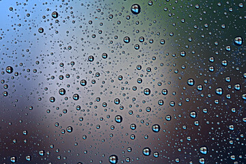 fresh drops background blue glass / wet rainy background, water drops transparent glass blue