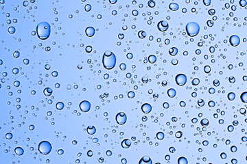 fresh drops background blue glass / wet rainy background, water drops transparent glass blue
