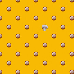 Champignon mushroom pattern on a yellow background, flat lay. Top view. 