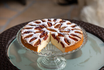 Delicious plum cake sprinkled with powdered sugar