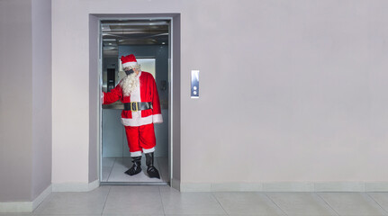 Man disguised as Santa Claus with a mask, inside an elevator in a building on Christmas Day