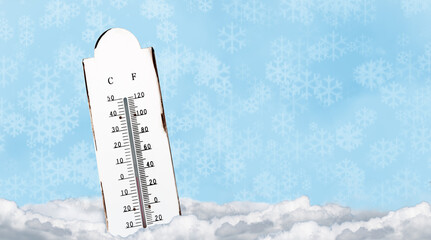 White outdoor thermometer with a temperature of zero degrees in the snow. Cold ice and freeze design background.