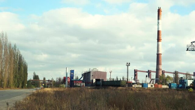 view of a working factory with a pipe