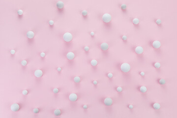 Christmas minimal concept. Snowballs on pink background.