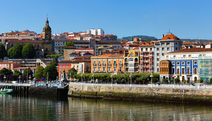 Fototapeta na wymiar Panoramic view of embankment in Portugalete city from Estuary of Bilbao, Spain