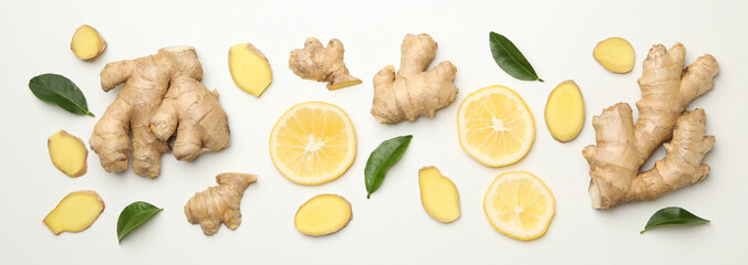 Fresh ginger and lemon on white background, top view
