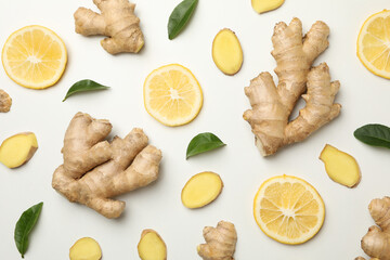 Fresh ginger and lemon on white background, top view