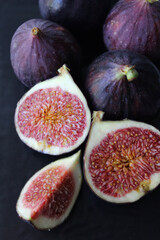 Fig slices are purple on a dark background