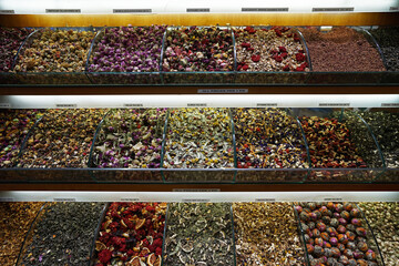 Retail display shelf of dried flower seasoning at Spice market located in the Eminönü quarter of the Fatih district, the most famous covered shopping complex after the Grand Bazaar- Istanbul, Turkey
