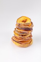 slices of dried peach on a white background. dried fruits. eco. macro.