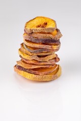 slices of dried peach on a white background. dried fruits. eco. macro.