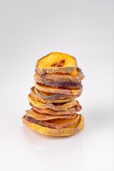 slices of dried peach on a white background. dried fruits. eco. macro.