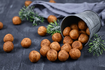 German traditional Christmas sweets called 'Marzipankartoffeln'. Round ball shaped almond paste...