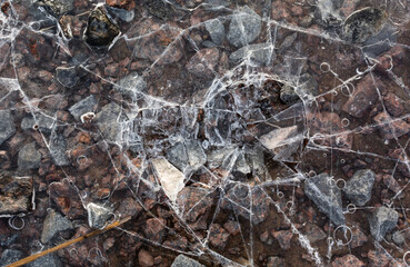 The texture of the stones under the ice