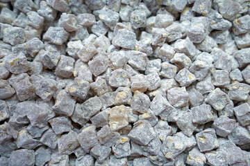 Close up display shelf of Turkish delight (lokum)- confections based on a gel of starch and sugar, Premium varieties consist largely of chopped dates, pistachios, and hazelnuts