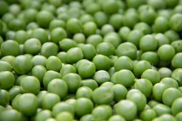 Obraz na płótnie Canvas FRESH green peeled peas texture outlook