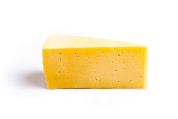 Shooting in the studio. A piece of yellow cheese, cut from the head. Close-up. On white background.