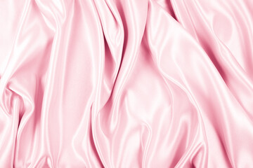 Obraz premium Beautiful elegant wavy light pink satin silk luxury cloth fabric texture, abstract background design. Copy space