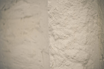 texture of old stone wall white plaster