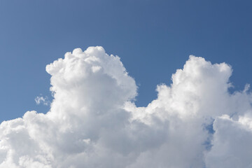 fluffy clouds and blue sky background