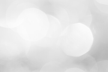 A brilliant white background with circles and ovals. Template for a holiday card with bright and sparkling lights.